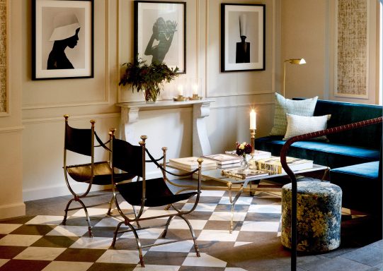 An elegant art-lined sitting room at Villa Dahlia